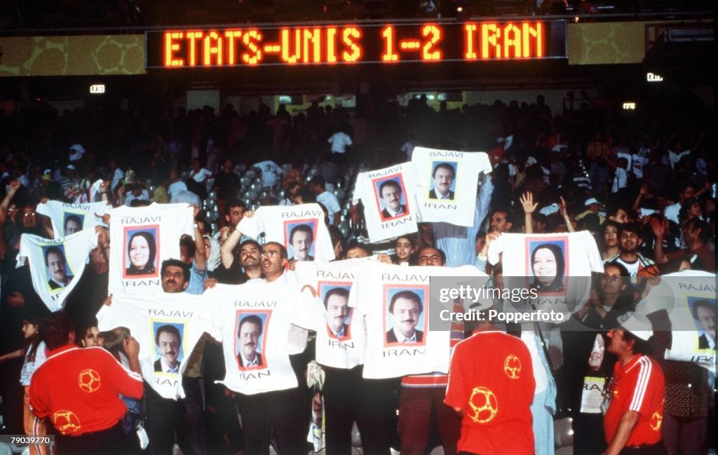 1998 World Cup Finals. Lyon, France. 21st JUNE 1998. USA 1 v Iran 2. Iranian fans celebrate after their team's win holding T-shirts displaying a political message.