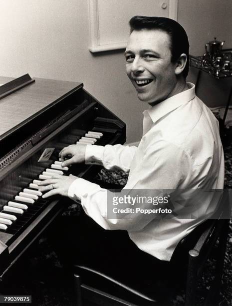 Music, England, 7th October 1967, Pop composer Les Reed pictured at work composing on a harpsichord previously owned by Beatle John Lennon