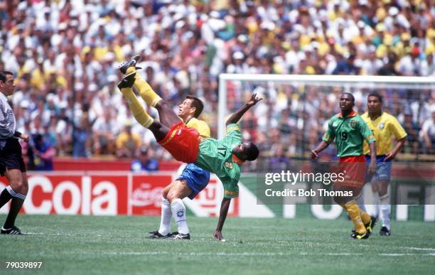 World Cup Finals, Stanford, USA, 24th June Brazil 3 v Cameroon 0, Cameroon's Marc Vivien Foe performs acrobatics as he tries a scissors kick to clear...
