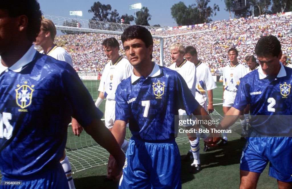 1994 World Cup Semi-Finals. Pasadena, USA. 13th July, 1994. Brazil 1 v Sweden 0. Brazil's Marcio Santos, Bebeto and Jorginho hold hands as they walk on to the pitch for their Semi-Final match