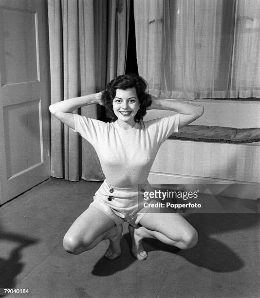 England British actress and former waitress Joan Rice is pictured doing some exercises