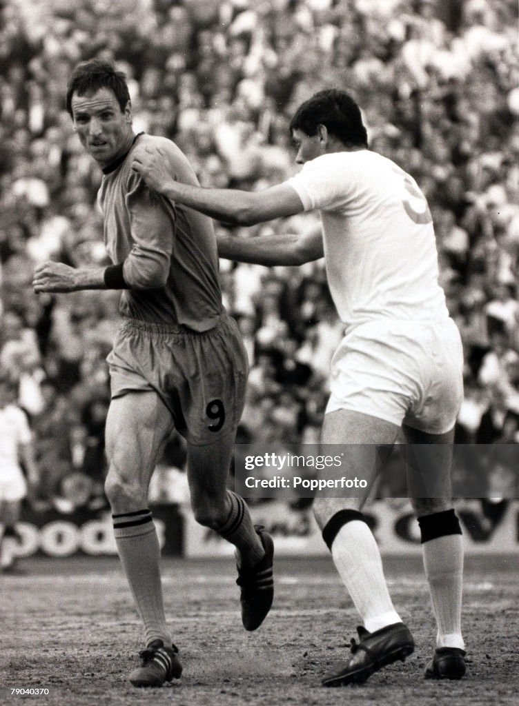 Sport. Football. League Division Two. Selhurst Park, London, England. 13th May 1967. Crystal Palace v Wolverhampton Wanderers. Wolverhampton Wanderers' striker Derek Dougan (left) tries to turn away from Crystal Palace's Eddie Presland who hold him.