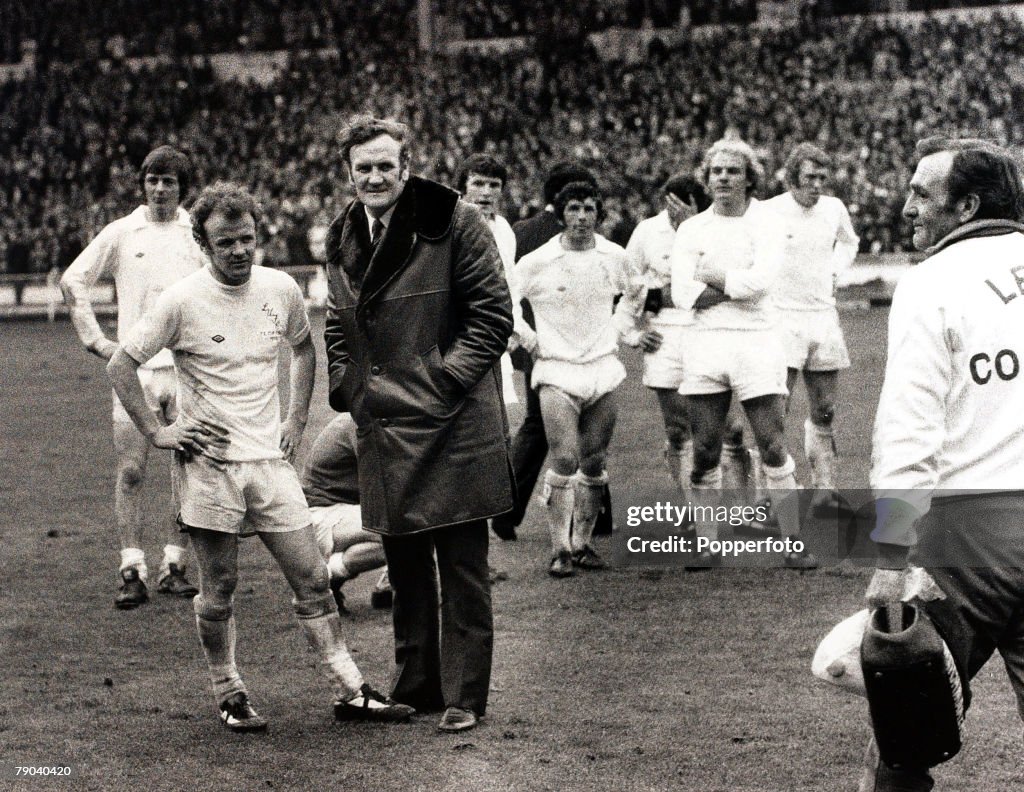 Sport. Football. FA Cup Final. Wembley, London, England. 5th May 1973. Sunderland 1 v Leeds United 0. Dejected Leeds United Manager Don Revie and his captain Billy Bremner are pictured with the crestfallen team after their shock defeat at the hands of the