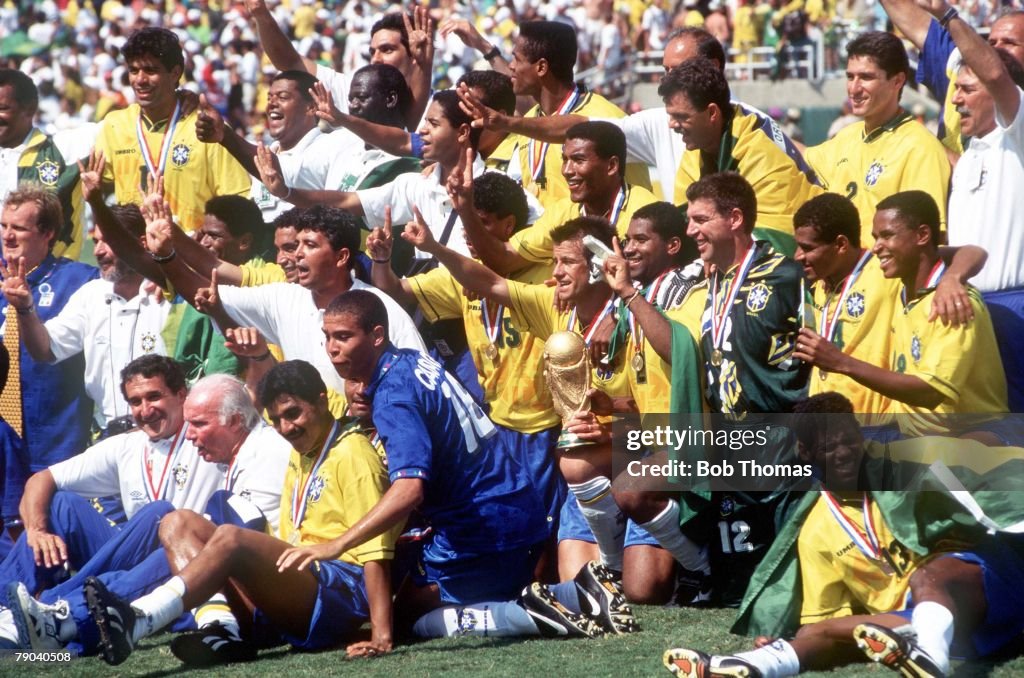 1994 World Cup Final. Pasadena, USA. 17th July, 1994. Brazil 0 v Italy 0. (Brazil won 3-2 on penalties) Brazilian team celebrate with the World Cup trophy after defeating Italy. Brazilian youngster Ronaldo wears an Italian shirt.