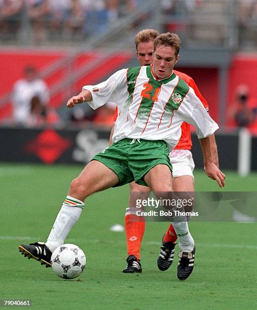 World Cup Finals, Orlando, USA, 4th July Holland 2 v Republic of Ireland 0, Ireland's Jason McAteer is shadowed by a Dutch defender
