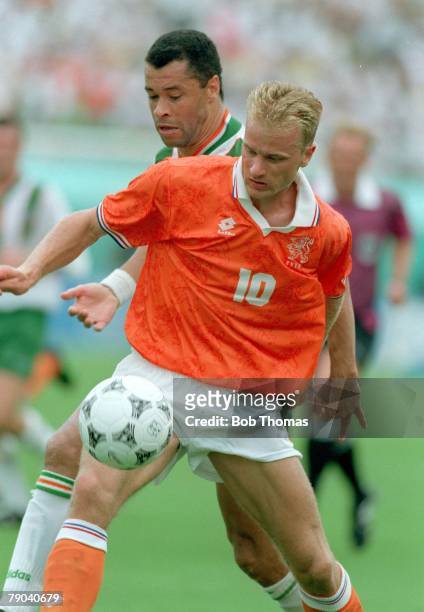World Cup Finals, Orlando, USA, 4th July Holland 2 v Republic of Ireland 0, Ireland's Paul McGrath battles for the ball with Holland's Dennis Bergkamp