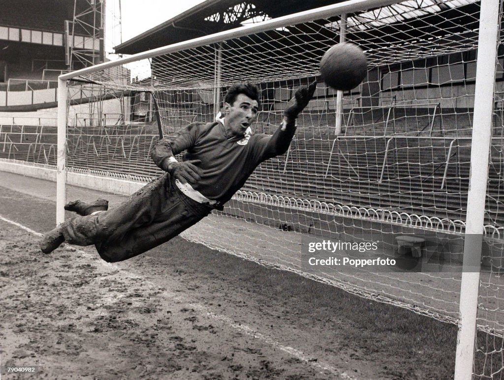 Sport. Football. White Hart Lane, London, England. 3rd April 1962. Benfica goalkeeper Alberto Da Costa Pereira is pictured making a diving save during training as the Portuguese team prepare to play Tottenham Hotspur in the Semi Final Second Leg of the Eu