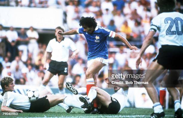 World Cup Finals, Semi-Final, Seville, Spain, 8th July West Germany 3 v France 3, , France's Michel Platini is tackled by West Germany's Karl Heinz...