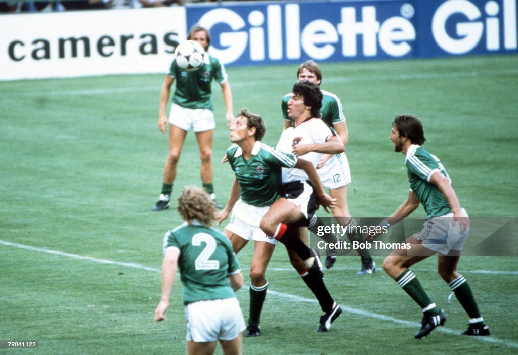 1982 World Cup Finals. Madrid, Spain. 1st July, 1982. Austria 2 v Northern Ireland 2. Northern Ireland's Sammy Nelson (C) is challenged for the ball by Austria's Reinhold Hintermayer.