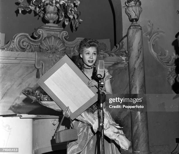 England American dancer and actress Vera Ellen is pictured on the set of the variety television show "In Town Tonight"