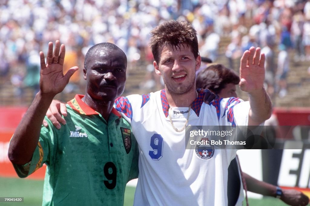 1994 World Cup Finals. Stanford, USA. 28th June 1994. Russia 6 v Cameroon 1. Russian top goalscorer of thetournament Salenko with the tournament's oldest player Roger Milla after the match