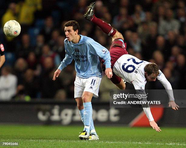 Elano of Manchester City vies with Lee Bowyer of West Ham United during the Fa cup third round replay football match at The City of Manchester...