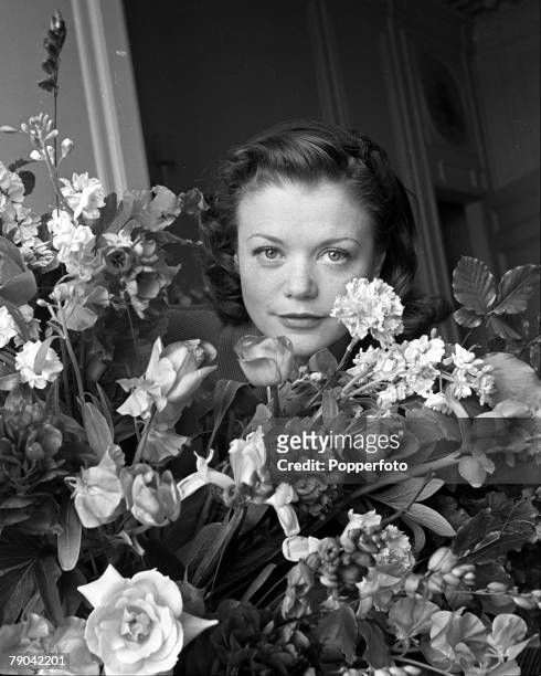 12th June 1946, London, England, A picture of French film actress Simone Simon with a bouquet of flowers at the Savoy Hotel