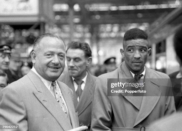 Boxing, London, England British middleweight boxer Randolph Turpin with promote Jack Solomons leaving Waterloo Station for an upcoming fight