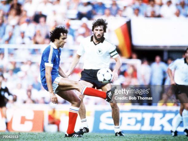 World Cup Finals, Semi-Final, Seville, Spain, 8th July West Germany 3 v France 3, , France's Michel Platini is faced by Manny Kaltz