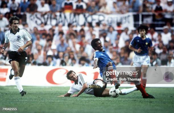 World Cup Finals, Semi-Final, Seville, Spain, 8th July West Germany 3 v France 3, , France's Jean Tigana is tackled by West Germany's Wolfgang...