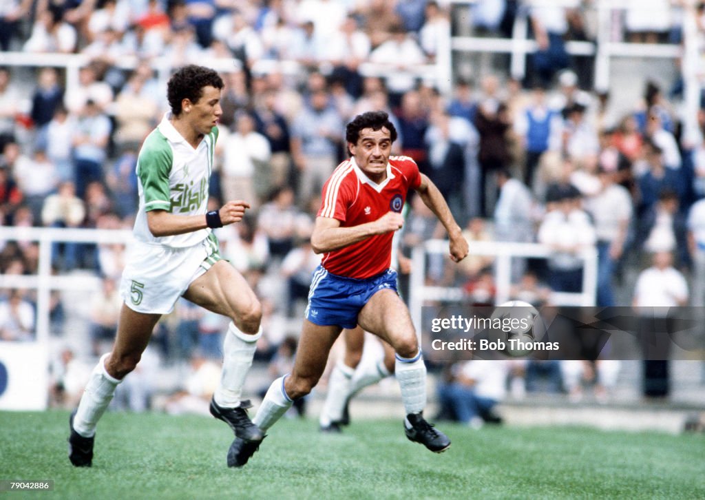 1982 World Cup Finals. Oviedo, Spain. 24th June, 1982. Algeria 3 v Chile 2. Algeria's Chaabane Merzekane chases Chile's Gustavo Moscoso for the ball