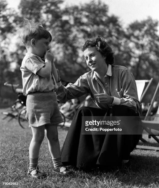 London, England American actress Betsy Blair is pictured in a park with her son