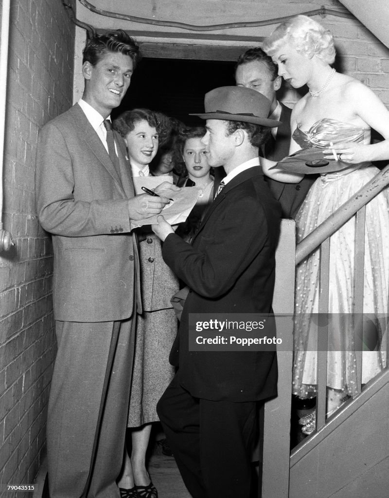 1954. Walthamstow, London. Radio Luxembourg Disc Jockey Peter Murray is pictured signing an autograph for a "Teddy" boy at the Granada Cinema watched by Billie Anthony (right).