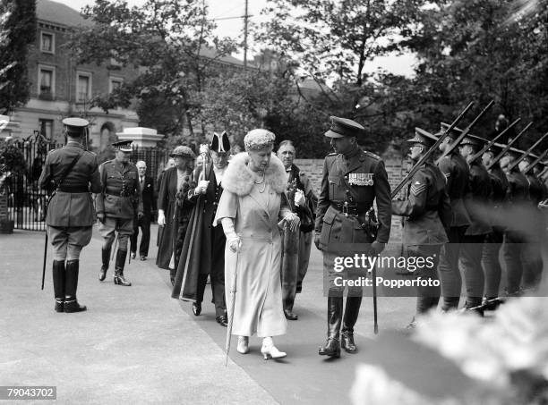 British Royalty, England, 22nd July 1939, Queen Mary, wife of the late King George V, pictured at an official ceremony with a military guard of honour