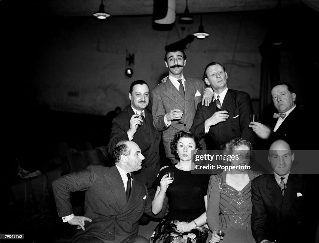 Entertainment. Radio. England. circa 1948. The popular radio show "Much Binding in the Marsh" has it's success toasted by the people who made it so well known, front L-R: Kenneth Horne, Maureen Riscoe, Helen Hill, Maurice Denham and middle two at the back