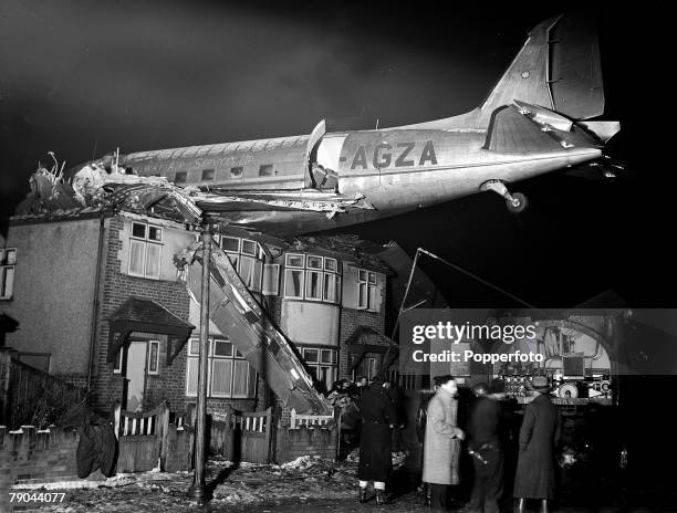 Douglas Dakota 3 aircraft of the British airline Railway Air Services involved in a freak accident after crashing and becoming embedded in a house in...