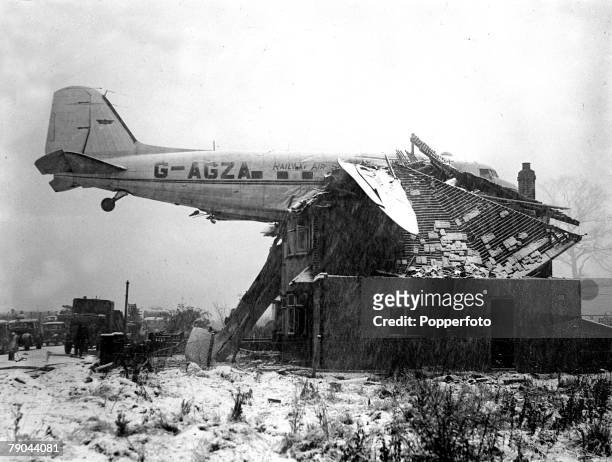 Douglas Dakota 3 aircraft of the British airline Railway Air Services involved in a freak accident after crashing and becoming embedded in a house in...