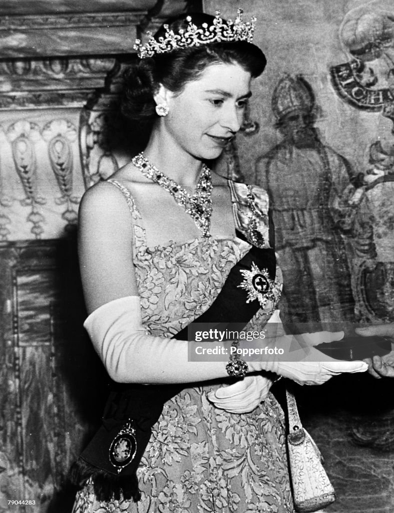 British Royalty. circa 1950's. H.M.Queen Elizabeth II wearing a fine array of jewels, the bejewelled order of the garter a tiara and bracelet and a lovely ruby and diamond necklace.