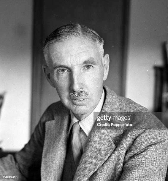 British Army officer General Arthur Percival seated at a desk to write his report on the fall of Singapore, at home in Hertfordshire, England on 17th...