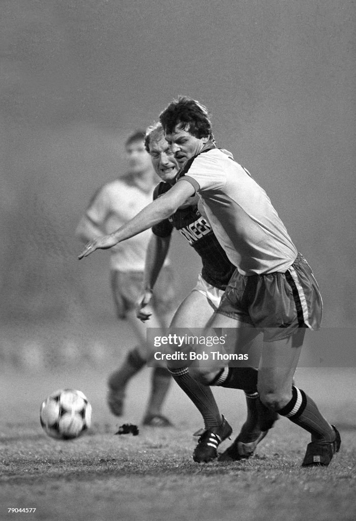 Football. English League Cup 5th Round. Ipswich, England. 18th January 1982. Ipswich Town 2 v Watford 1. Watford's Ian Bolton is challenged for the ball by Ipswich's Alan Brazil.