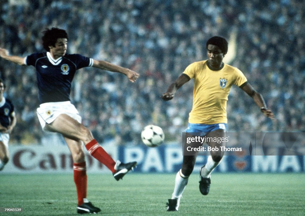 1982 World Cup Finals. Seville, Spain. 18th June, 1982. Brazil 4 v Scotland 1. Scotland's Alan Hansen clears past Brazil's Serginho.