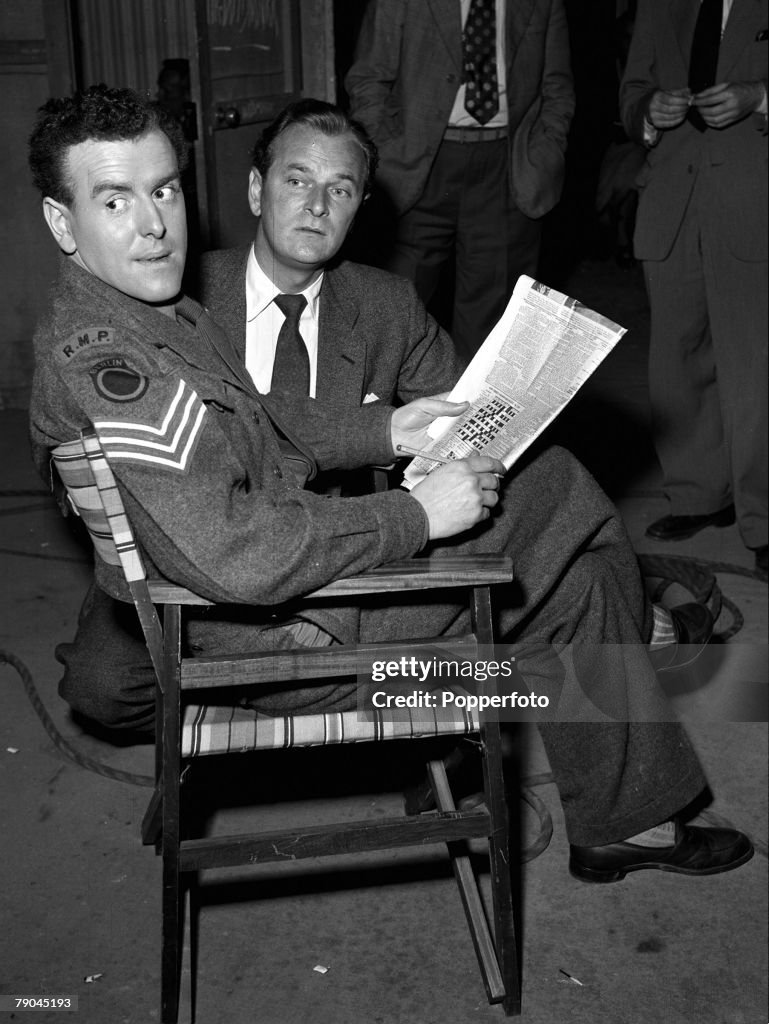 1954. England. A picture of British actors George Cole and Nigel Patric on the set of the film "Prize of Gold".