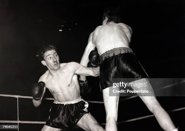 Sport, Boxing, Albert Hall, London, England, 11th December 1951, Lightweight Boxing, Ronnie Kray takes a heavy punch to the chest during the fight he...