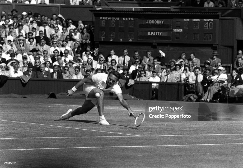 Sport. All England Lawn Tennis Championships. Wimbledon, London, England. 1954. Mens Singles Semi-Final. Czechoslovakia's Jaroslav Drobny stretches to hit a low forehand volley during his 6-2, 6-4, 4-6, 9-7 victory over USA's Budge Patty.