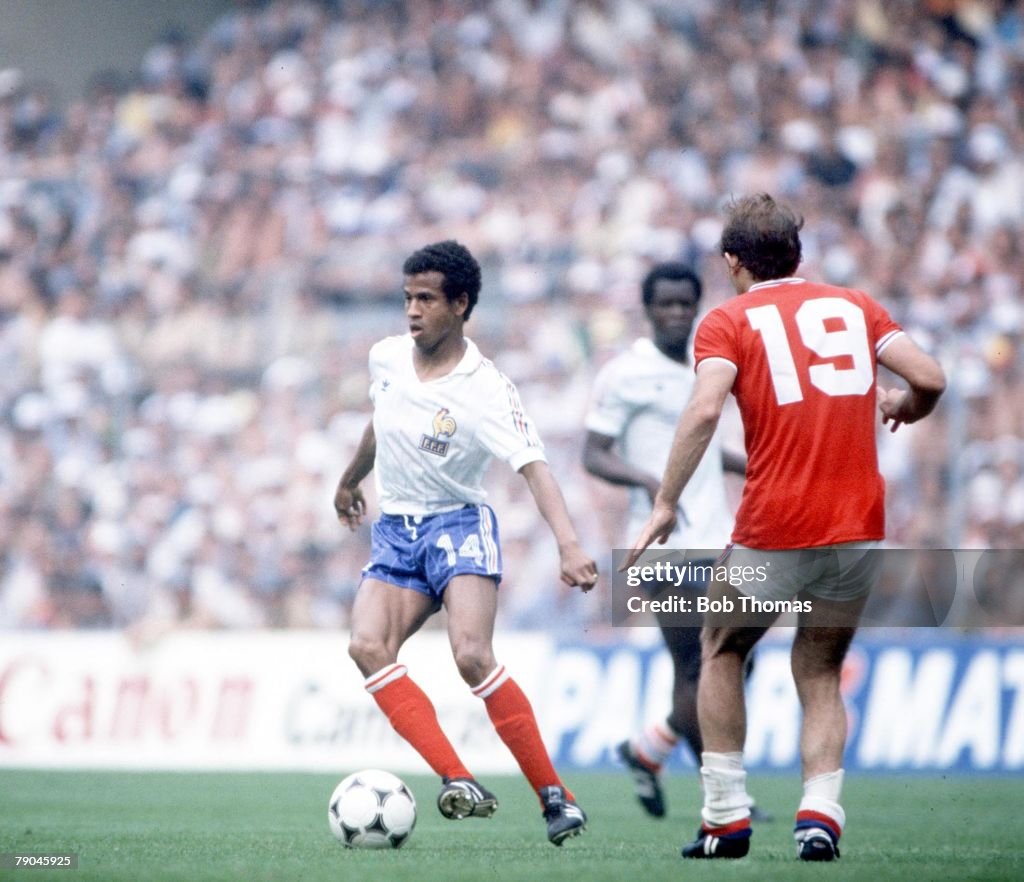 1982 World Cup Finals. Bilbao, Spain. 16th June, 1982. England 3 v France 1. France's Jean Tigana is faced by England's Ray Wilkins.