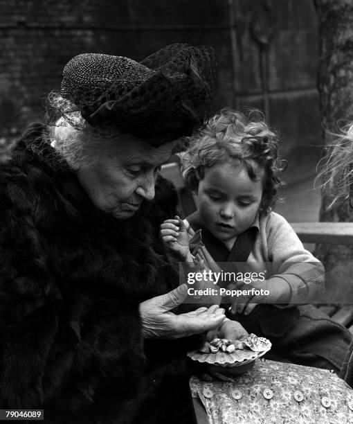 London, England Italian educational reformer Maria Montessori, who evolved the Montessori method of teaching children, is pictured during a visit to...