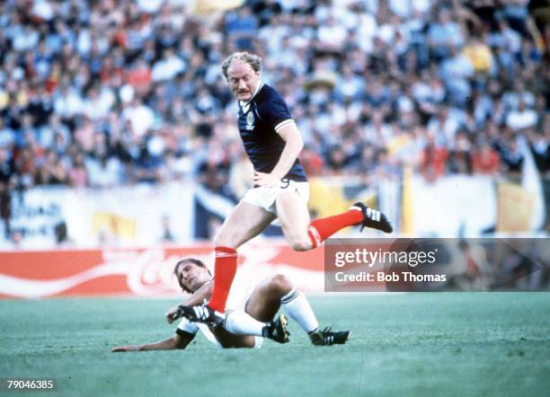 World Cup Finals, Malaga, Spain, 15th June Scotland 5 v New Zealand 2, Scotland's Alan Brazil leaps over New Zealand's Alan Boath