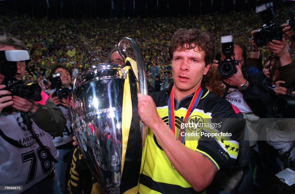 Football. UEFA Champions League Final. Munich, Germany. 28th May 1997. Borussia Dortmund 3 v Juventus 1. Borussia Dortmund's Andreas Moller holds the trophy as he is photographed.