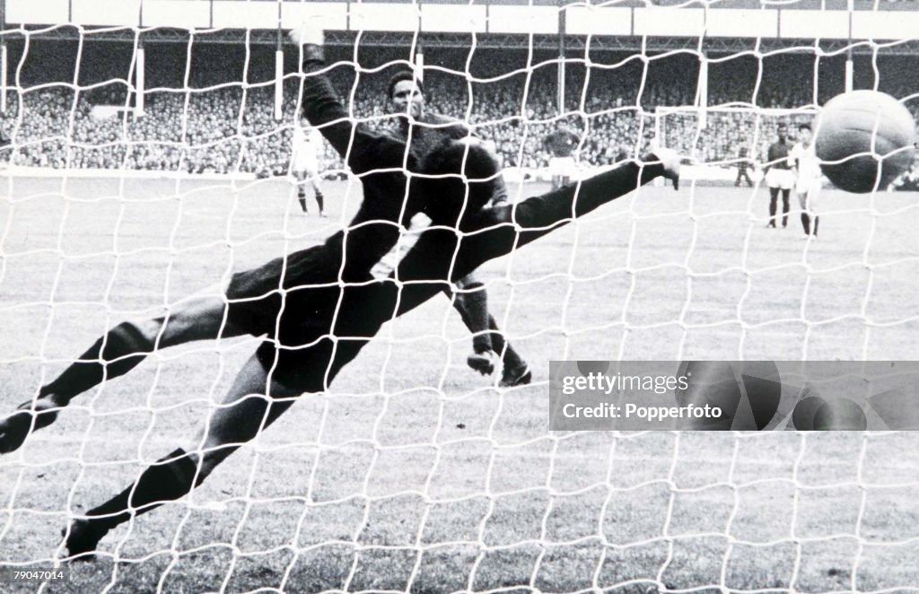 World Cup Finals, 1966. Liverpool, England. 23rd July, 1966. Portugal 5 v North Korea 3. Portugal's Eusebio scores one of his two penalties past the dive of North Korean goalkeeper Li Chang Myung during their match.