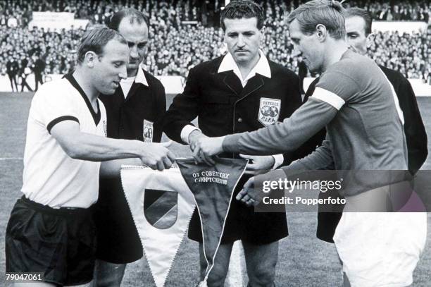 World Cup Semi-Final Liverpool, England, 25th July West Germany 2 v Soviet Union 1, West Germany's captain Uwe Seeler exchanges pennants with Soviet...