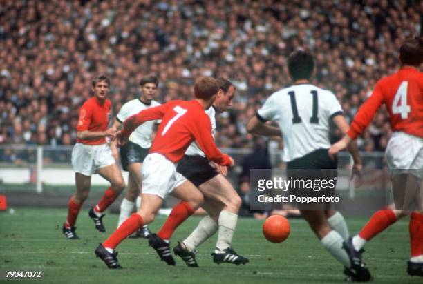 World Cup Final, Wembley Stadium, England, 30th July England 4 v West Germany 2, England's Alan Ball ball chases West Germany's Uwe Seeler as...