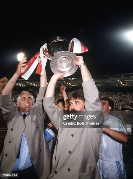 Football, European Cup Final, Stuttgart, West Germany, 25th May 1988, Benfica 0 v PSV Eindhoven 0 , PSV manager Guus Hiddink holds the trophy aloft