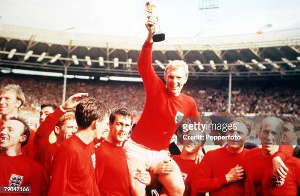 World Cup Final Wembley, England, 30th July, 1966 England 4 v West Germany 2, Englands captain Bobby Moore holds aloft the Jules Rimet World Cup...