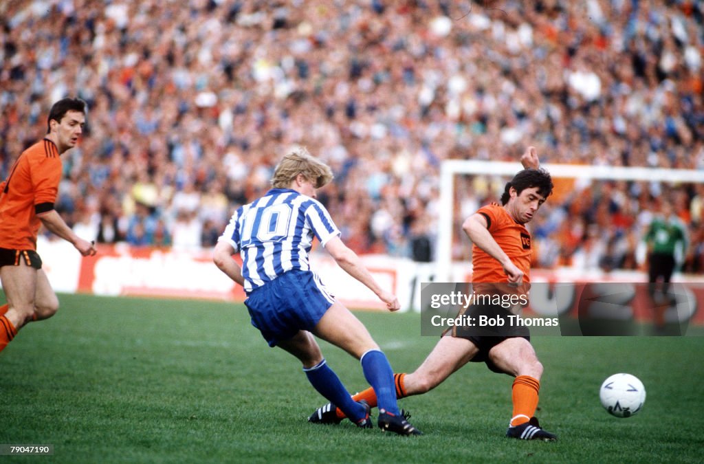 Football. UEFA Cup Final, Second Leg. Tannadice Park, Scotland. 20th May 1987. Dundee United 1 v IFK Gothenburg 1 (Gothenburg win 2-1 on aggregate). Gothenburg's Stefan Pettersson is tackled by Dundee United captain David Narey.