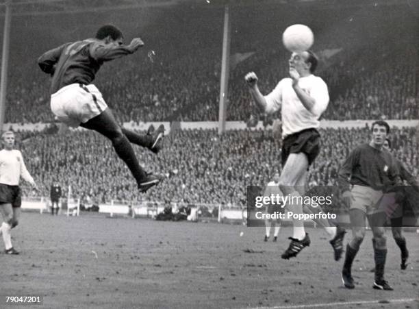 World Cup Semi-Final Wembley Stadium, England, 26th July England 2 v Portugal 1, England's Nobby Stiles jumps up for the ball with Portugal's Eusebio...