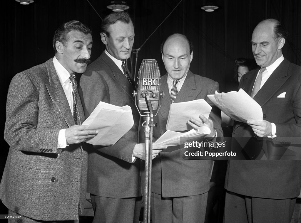 1949. London, England. A picture of Radio comedian Sam Costa during a BBC broadcast of the popular show "Much Binding" starring left to right: Costa, Richard Murdoch, Maurice Denham, and Kenneth Horne.