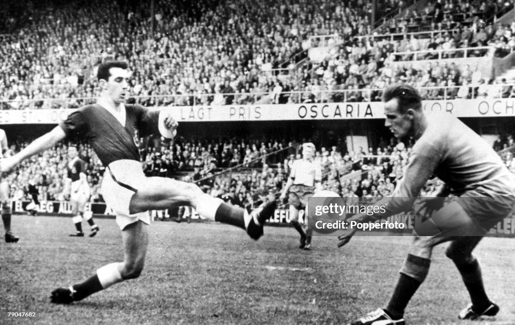 1958 World Cup Finals. Stockholm, Sweden. 15th June, 1958. Sweden 0 v Wales 0. Wales' inside-right Roy Vernon is stopped by Swedish goalkeeper Karl Svennson.