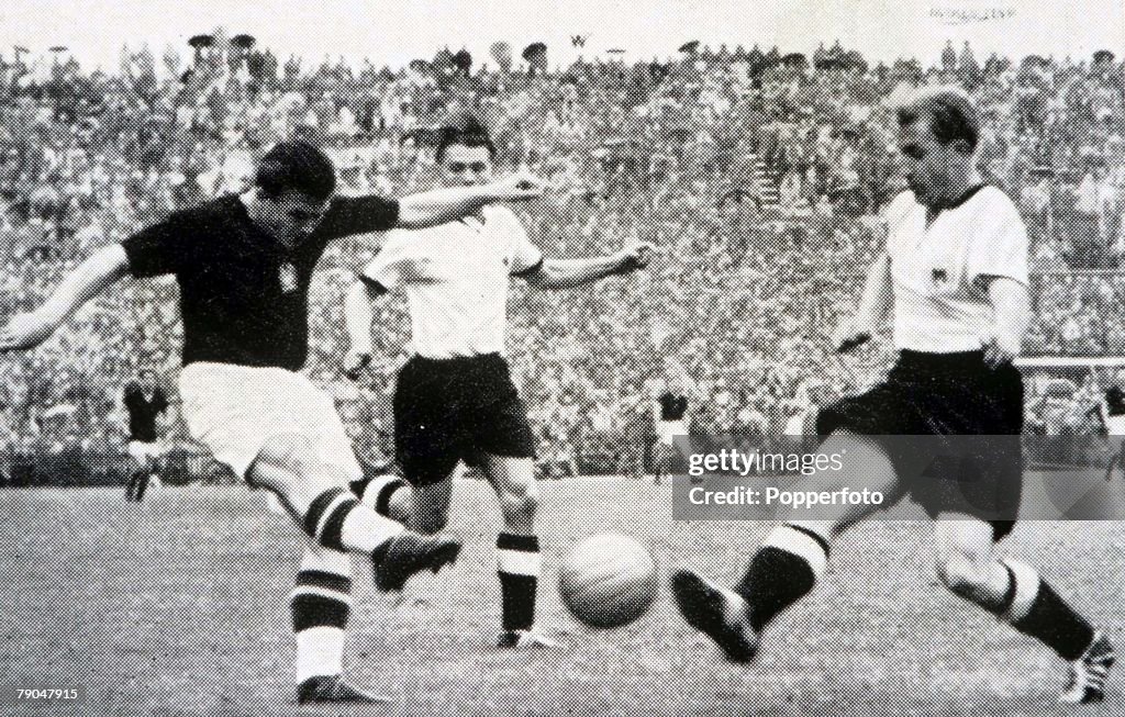 World Cup Final, 1954. Berne, Switzerland. 4th July, 1954. West Germany 3 v Hungary 2. Hungary's captain Ferenc Puskas shoots as West German defender Werner Liebrich challenges