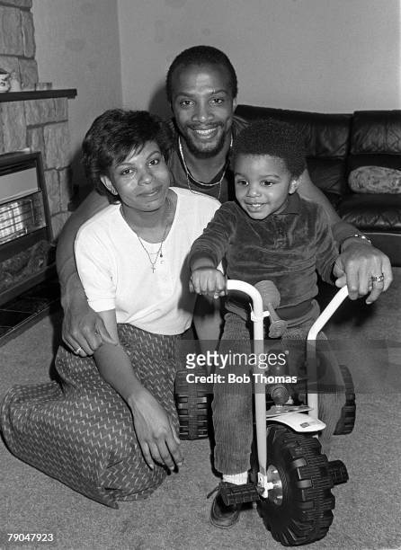 Football, 18th October 1982, Portrait of West Bromwich Albion and England footballer Cyrille Regis with his wife and son Robert in their home