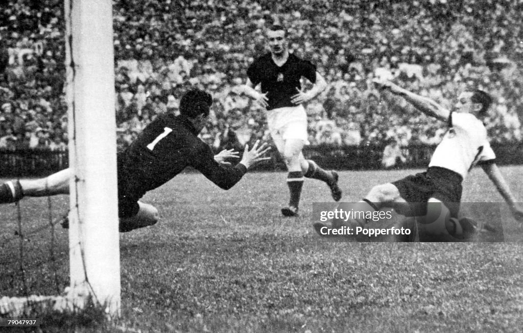 World Cup Final, 1954. Berne, Switzerland. 4th July, 1954. West Germany 3 v Hungary 2. West Germany's Max Morlock slides home his side's first goal past Hungarian goalkeeper Grosics to start their comeback.